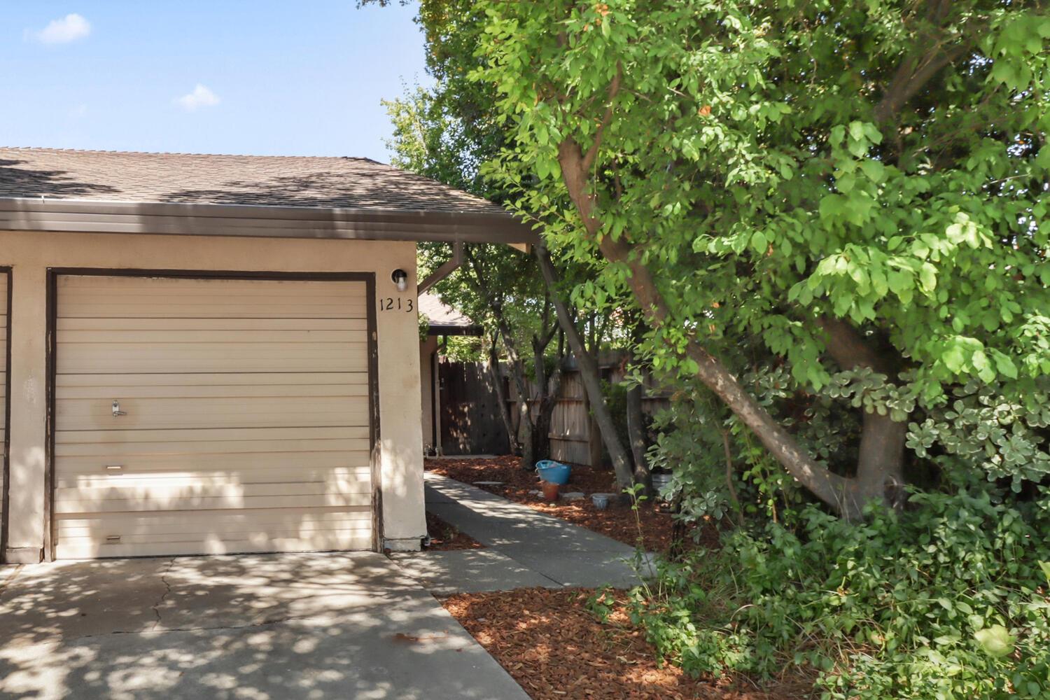 1213 Arthur Street Davis, CA 95616 - Photo 2 of 42 a view of a pathway of a house with a tree