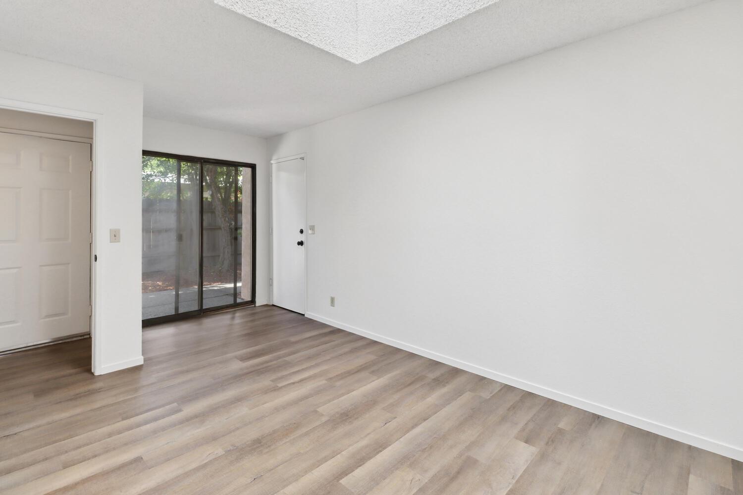 1213 Arthur Street Davis, CA 95616 - Photo 24 of 42 an empty room with wooden floor & closet and windows