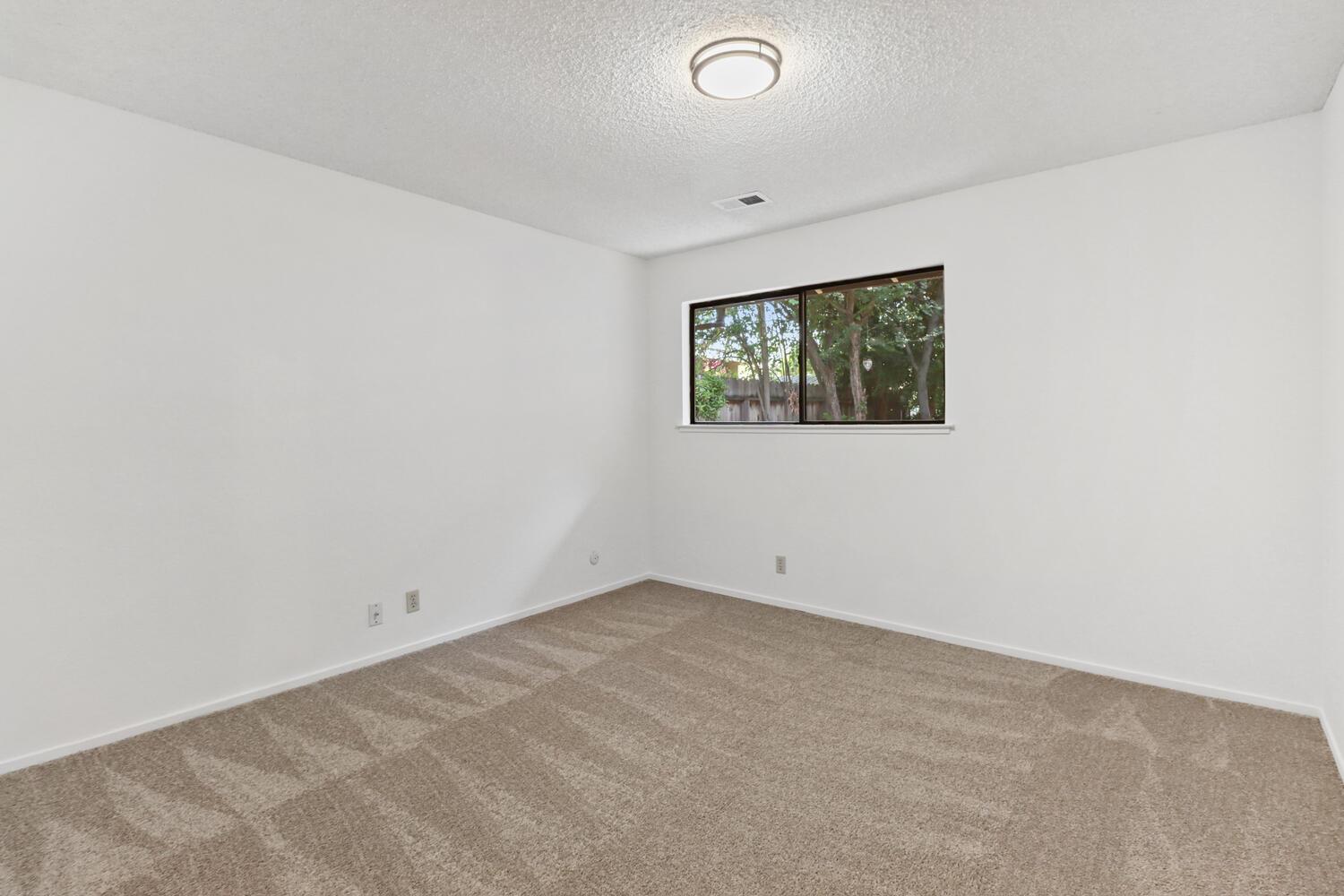 1213 Arthur Street Davis, CA 95616 - Photo 29 of 42 an empty room with windows