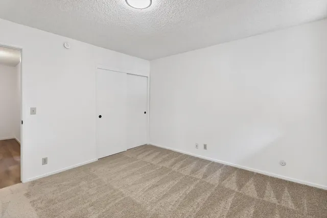 a bathroom with a granite countertop toilet sink and bathtub