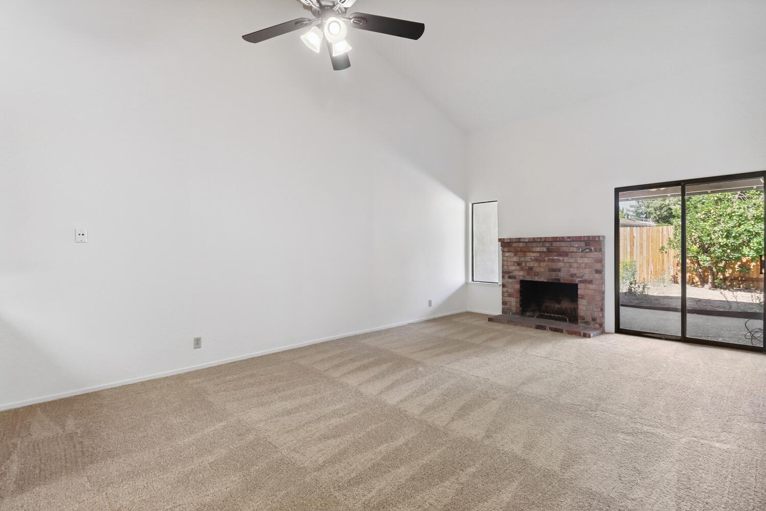 1213 Arthur Street Davis, CA 95616 - Photo 8 of 42 a view of an empty room with a fireplace