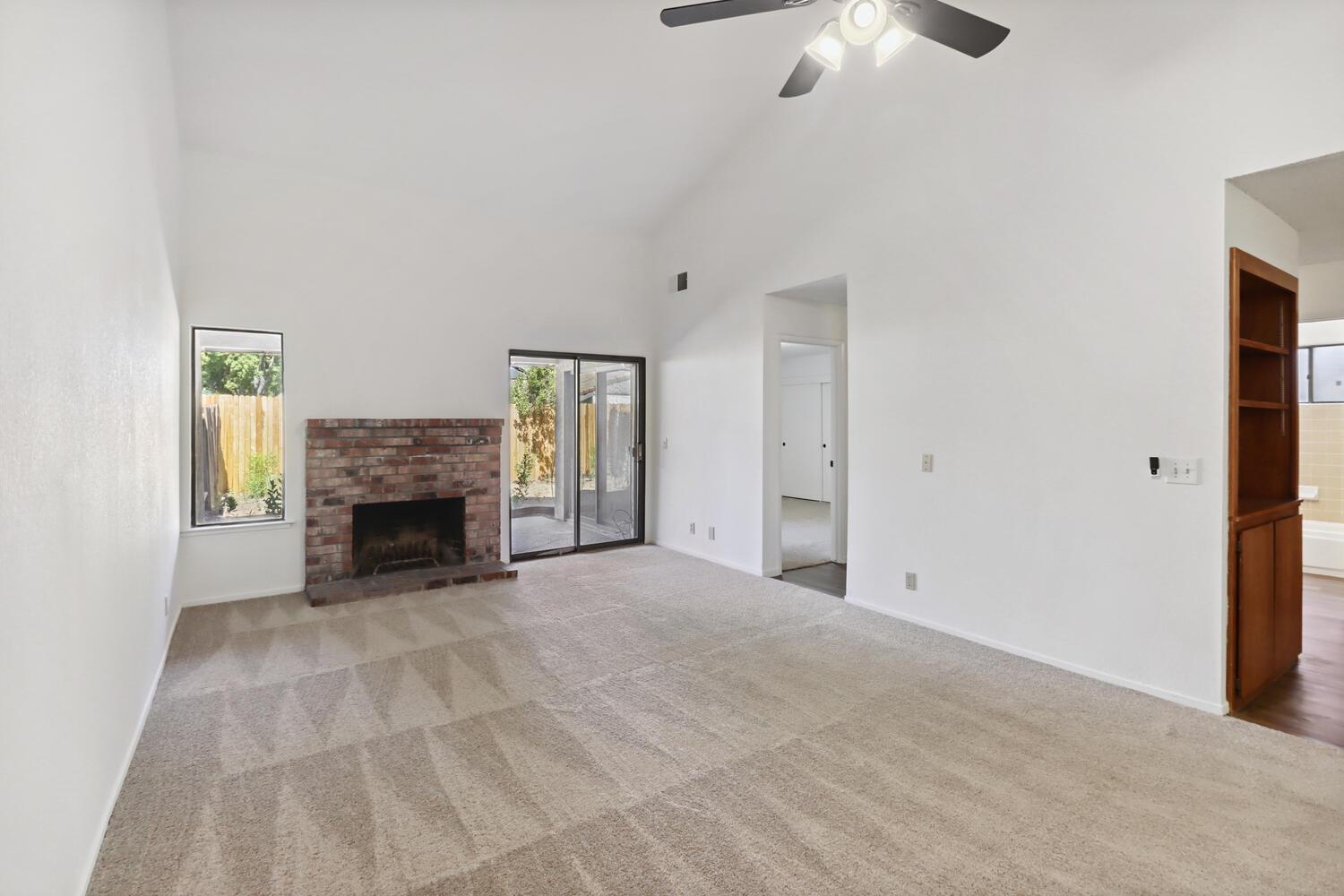 1213 Arthur Street Davis, CA 95616 - Photo 9 of 42 a view of an empty room with a fireplace