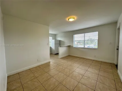 a view of an empty room and window