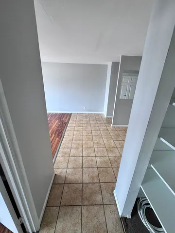 a view of wooden floor in hallway