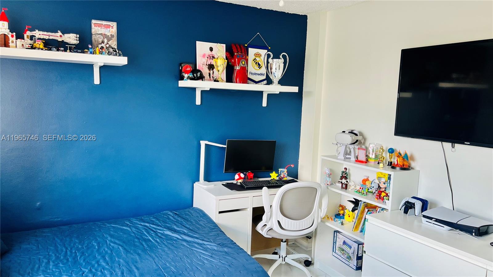 14250 Southwest 62nd Street, Unit 319 Miami, FL 33183 - Photo 18 of 29 a bathroom with a toilet a sink and a mirror
