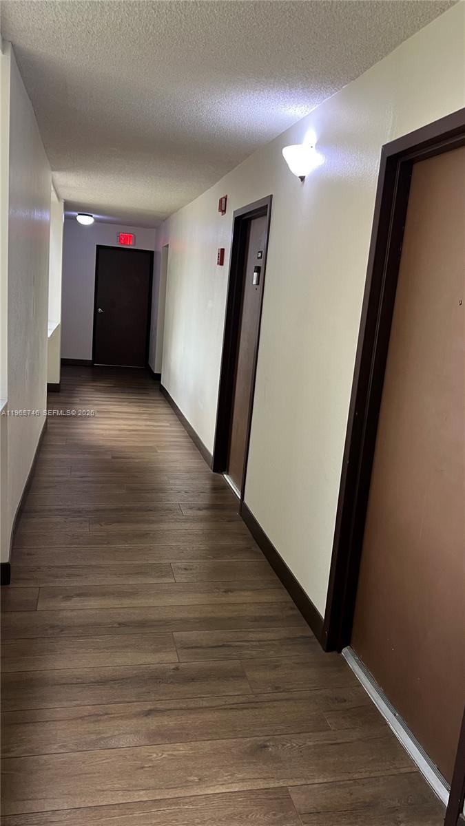 14250 Southwest 62nd Street, Unit 319 Miami, FL 33183 - Photo 23 of 29 a view of entryway with stairs and wooden floor