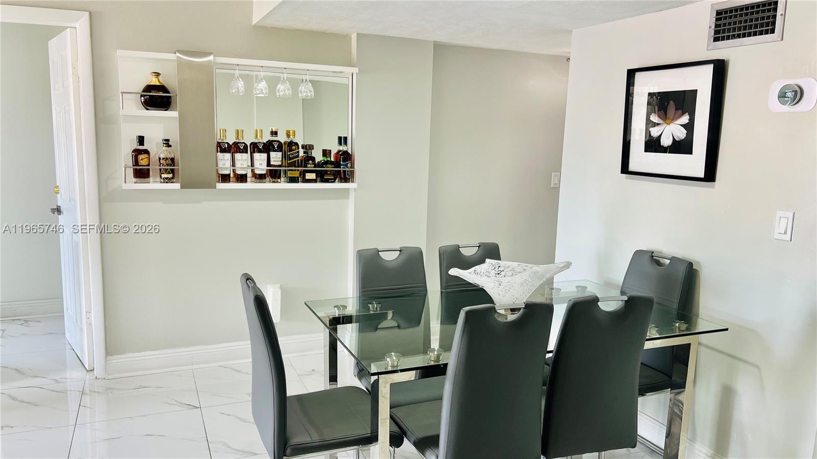 14250 Southwest 62nd Street, Unit 319 Miami, FL 33183 - Photo 4 of 29 a view of a dining room with furniture