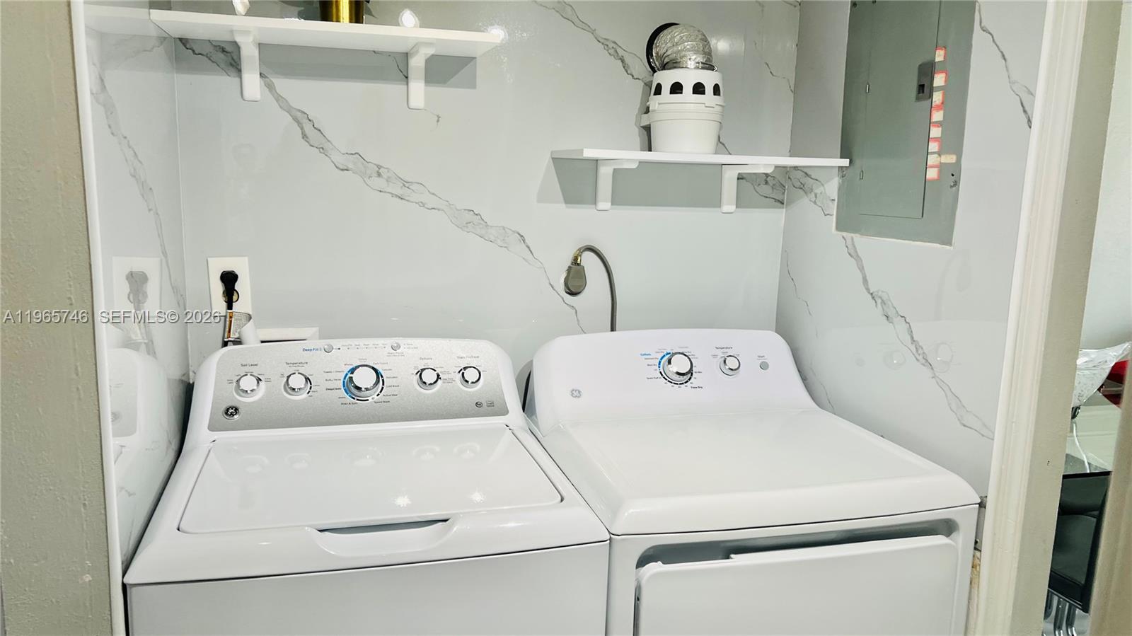 14250 Southwest 62nd Street, Unit 319 Miami, FL 33183 - Photo 8 of 29 a utility room with dryer and washer