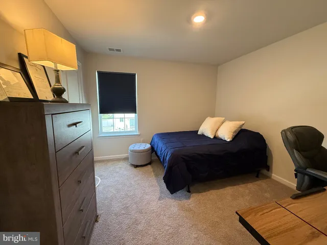 a bedroom with a bed and furniture