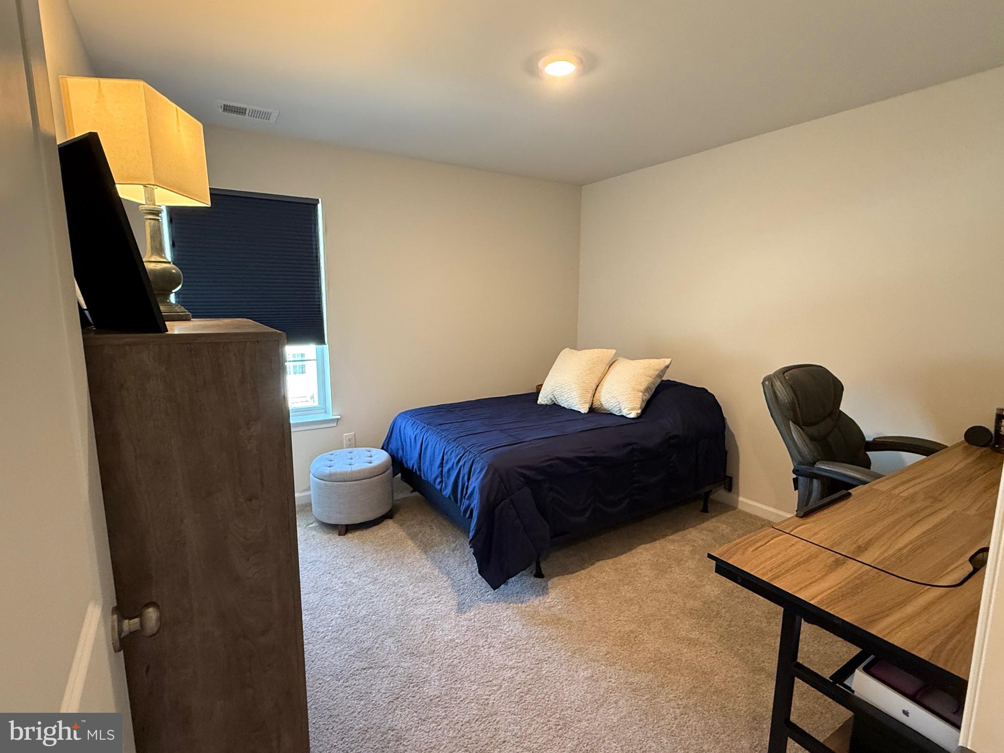 13 Outsail Avenue Barnegat, NJ 08005 - Photo 22 of 32 a bedroom with furniture and a chair