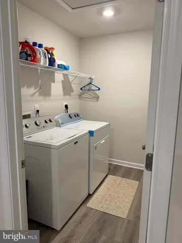a view of a patio with table and chairs under an umbrella