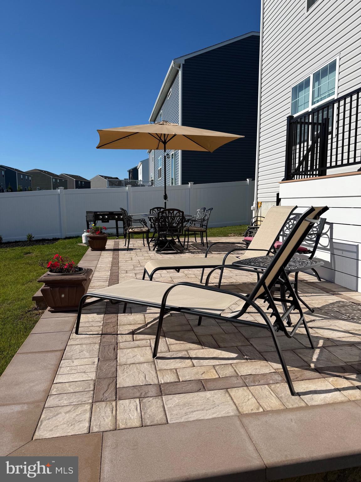 13 Outsail Avenue Barnegat, NJ 08005 - Photo 26 of 32 a view of a patio with table and chairs under an umbrella