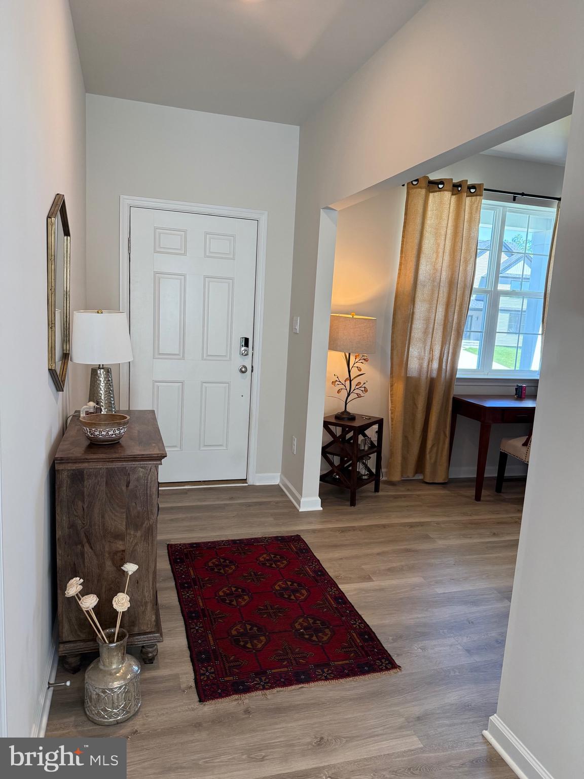 13 Outsail Avenue Barnegat, NJ 08005 - Photo 6 of 32 a living room with furniture a large window and wooden floor