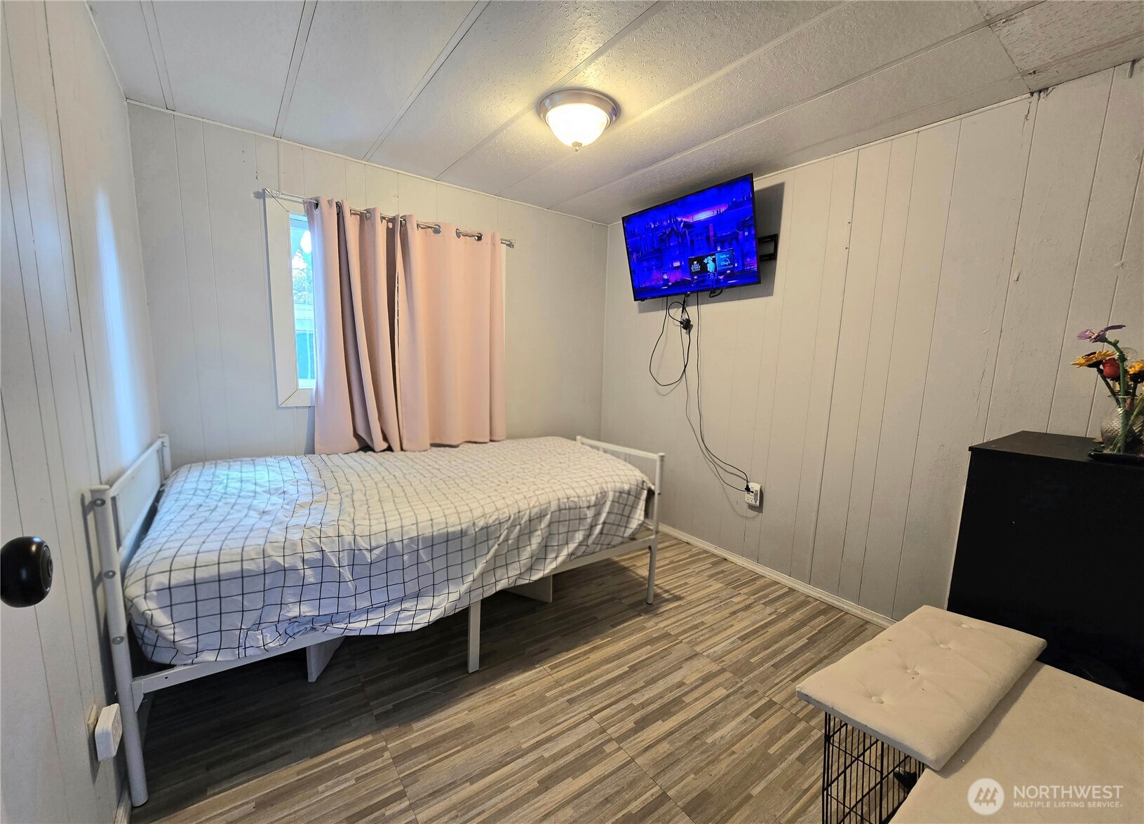 38 Hurd Road, Unit 35 Elma, WA 98541 - Photo 13 of 20 a bedroom with a bed and wooden floor