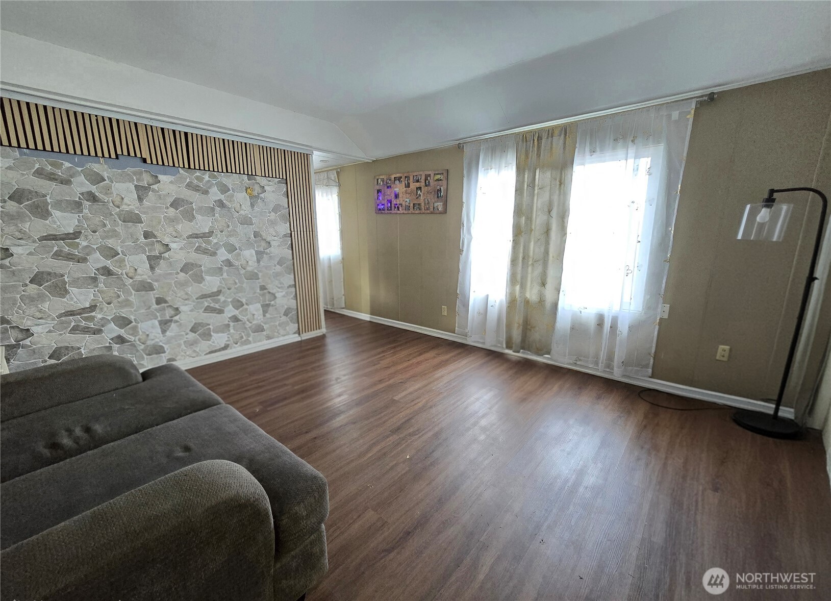 38 Hurd Road, Unit 35 Elma, WA 98541 - Photo 9 of 20 an empty room with wooden floor and windows