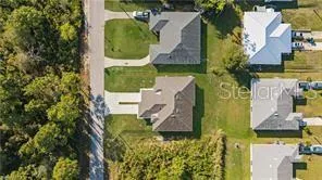 an aerial view of a house with outdoor space