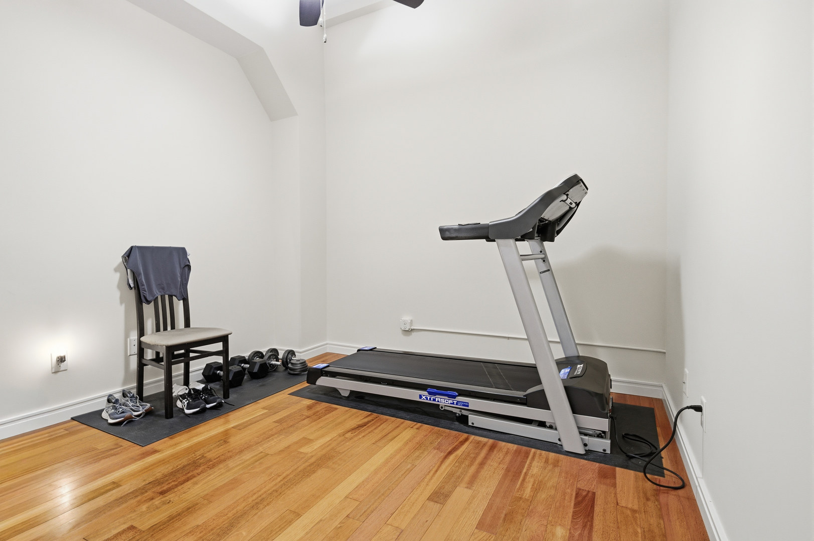 212 North Center Street, Unit 301 Bloomington, IL 61701 - Photo 15 of 39 a room with gym equipment and wooden floor