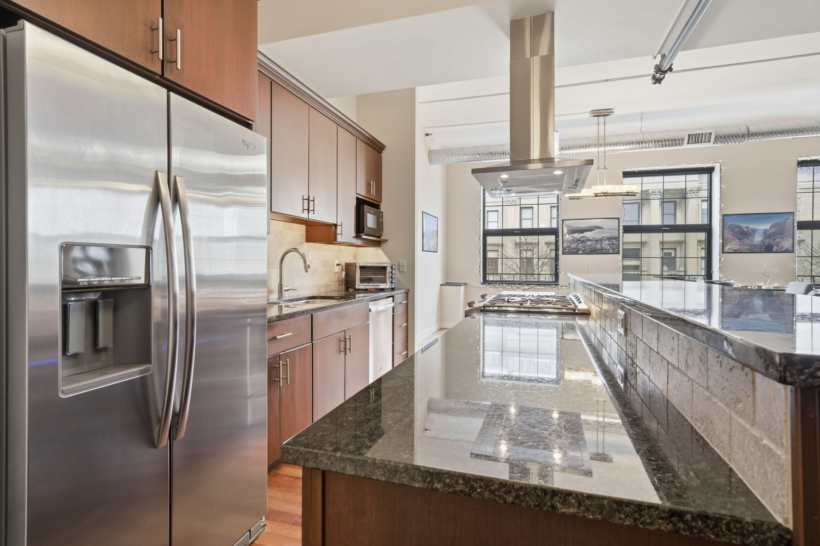 212 North Center Street, Unit 301 Bloomington, IL 61701 - Photo 17 of 39 a kitchen with stainless steel appliances granite countertop a refrigerator and a stove