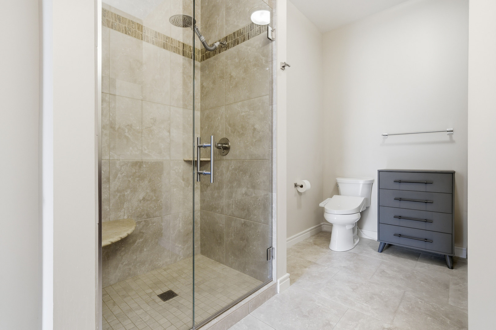 212 North Center Street, Unit 301 Bloomington, IL 61701 - Photo 28 of 39 a bathroom with a shower a toilet and a shower