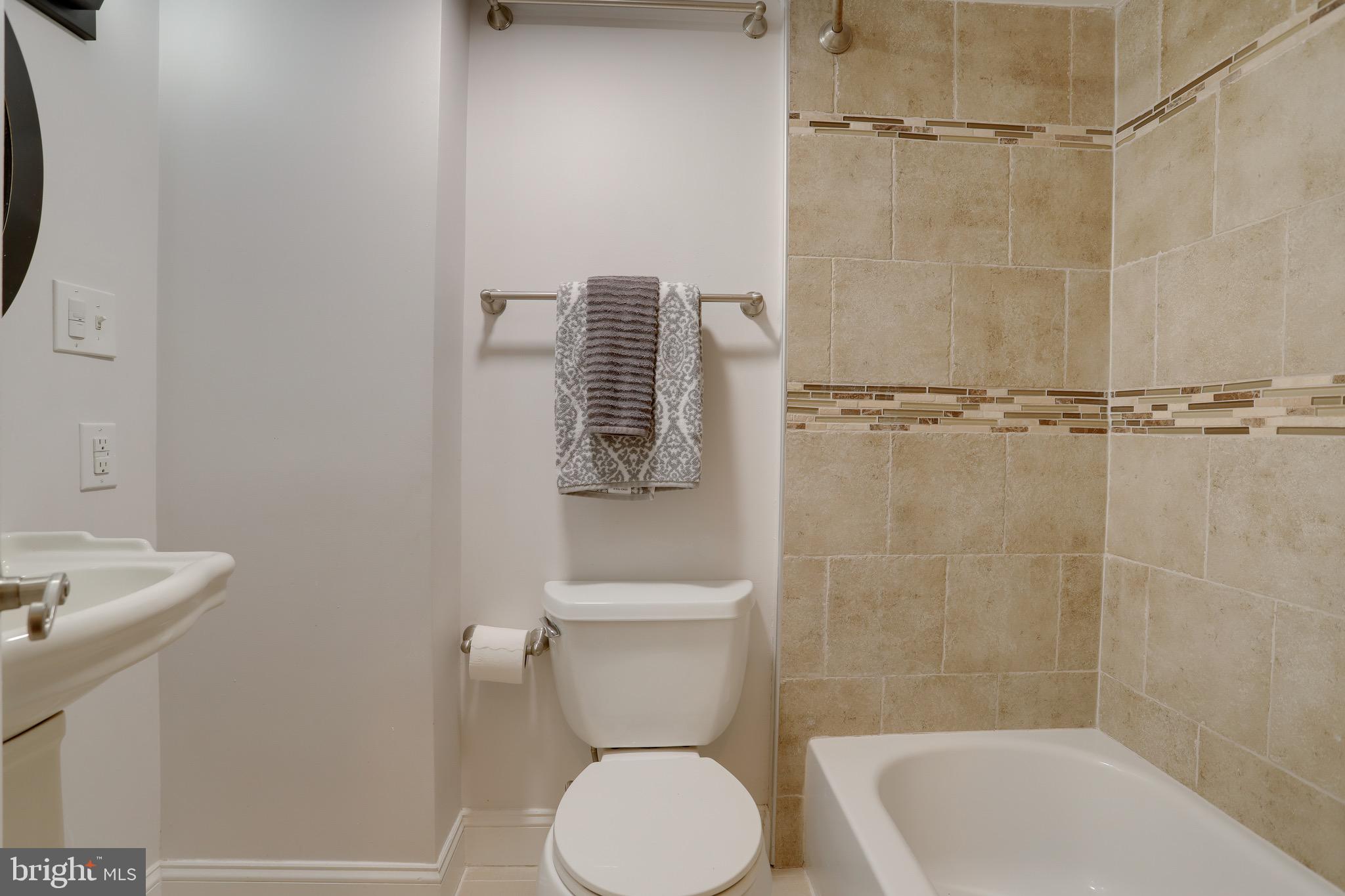 1437 A Street Northeast, Unit 1437 Washington, DC 20002 - Photo 35 of 46 Comfortable tiled full bathroom