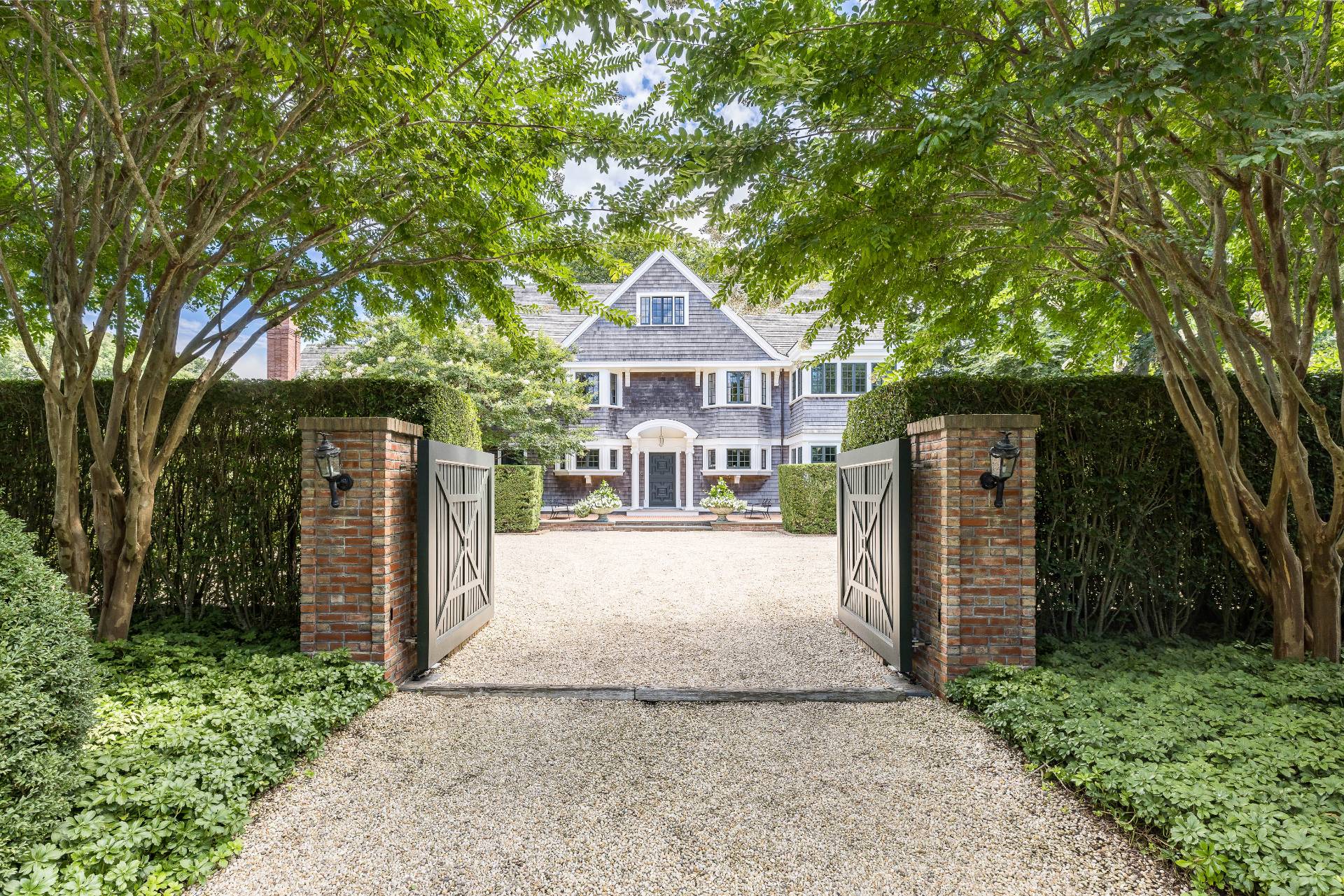 43 Lee Avenue East Hampton, NY 11937 - Photo 1 of 49 a front view of a house with a yard and garage