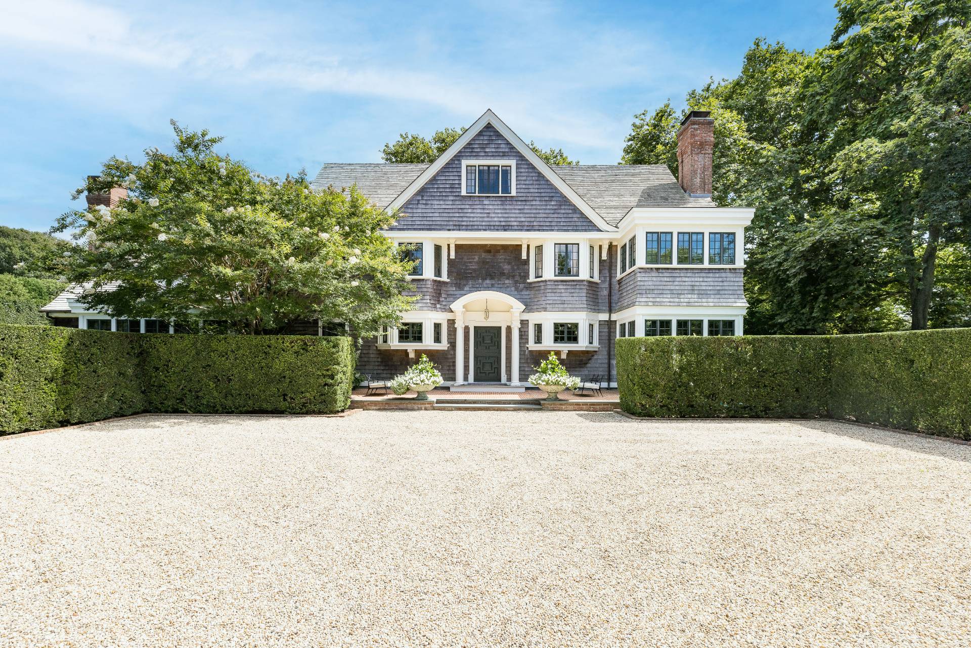43 Lee Avenue East Hampton, NY 11937 - Photo 16 of 49 a front view of a house with yard and green space