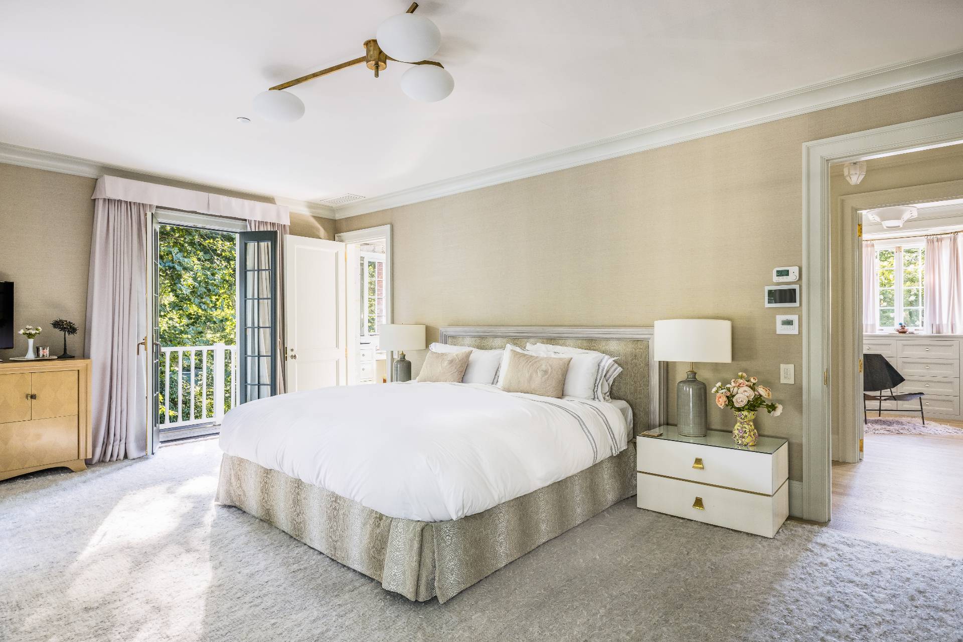 43 Lee Avenue East Hampton, NY 11937 - Photo 32 of 49 a spacious bedroom with a bed and a large window