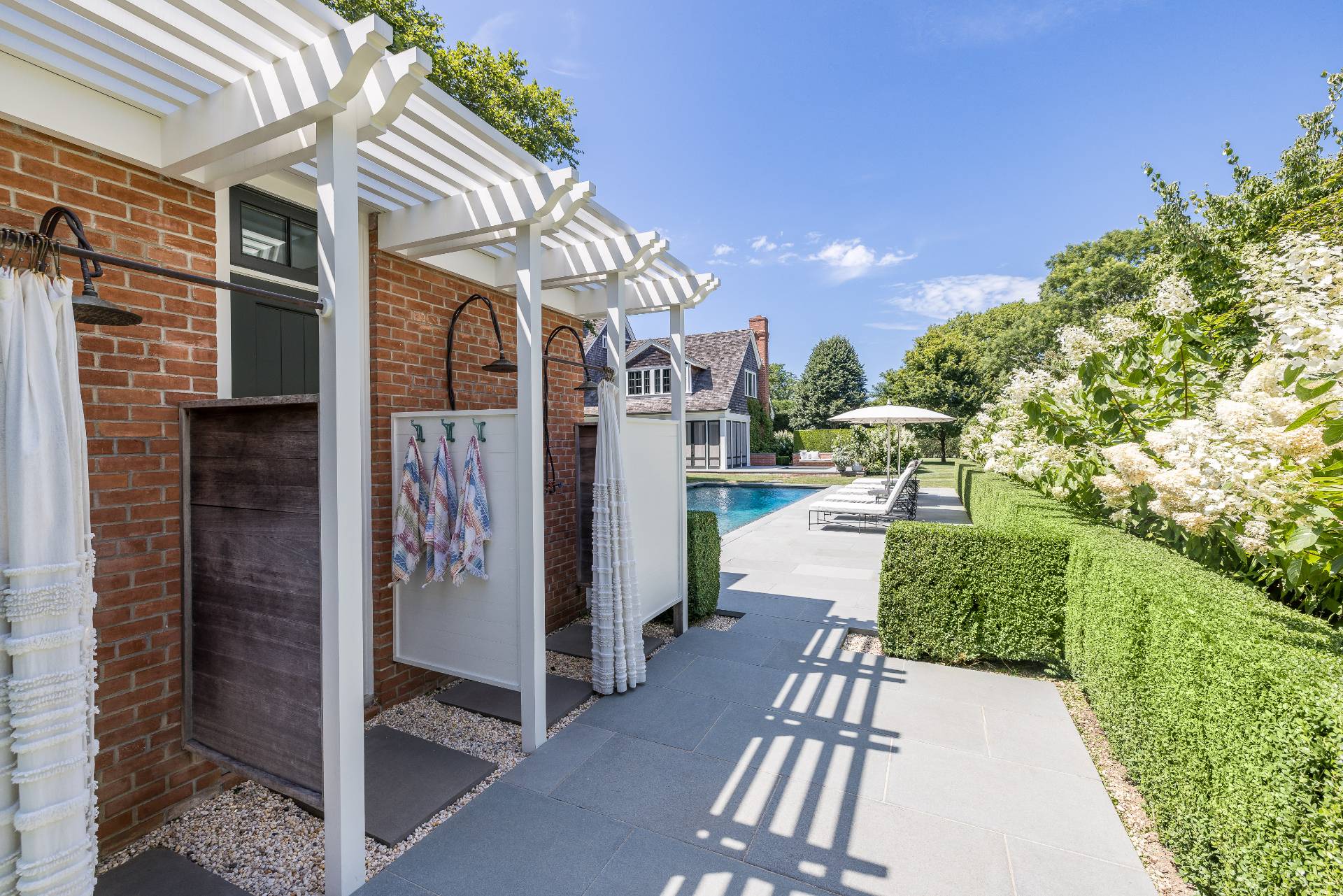 43 Lee Avenue East Hampton, NY 11937 - Photo 10 of 49 a view of a porch with a table and chairs