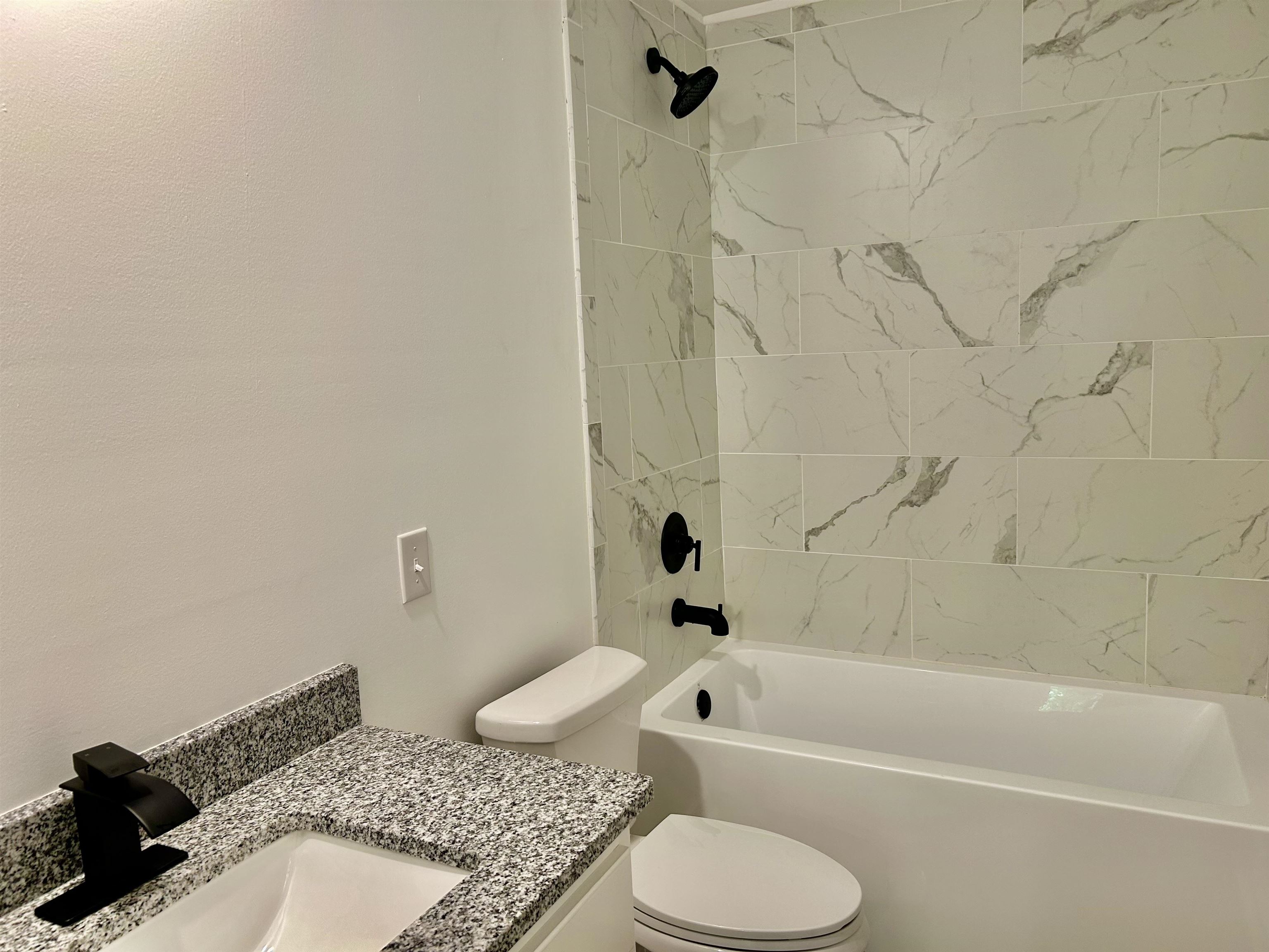 35 Grapevine Cove Counce, TN 38326 - Photo 15 of 25 a bathroom with a granite countertop sink toilet and shower