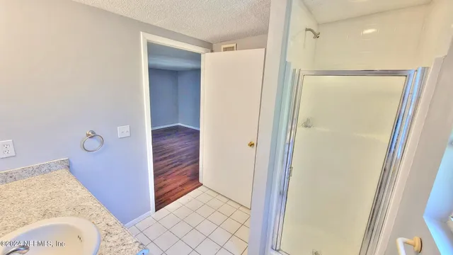 a bathroom with a tub and a shower