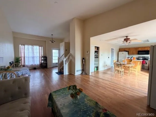 a view of a livingroom with furniture window and wooden floor