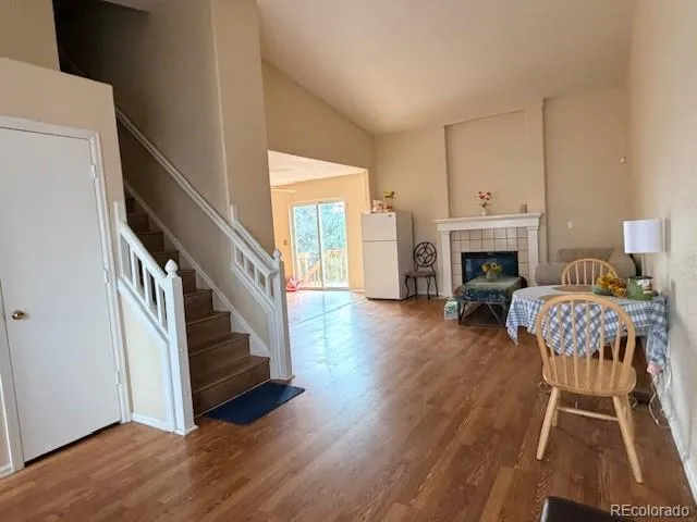 a view of entryway with wooden floor and stairs