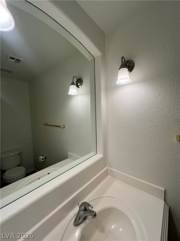 7204 Buglehorn Street Las Vegas, NV 89131 - Photo 11 of 30 Down guest half bath