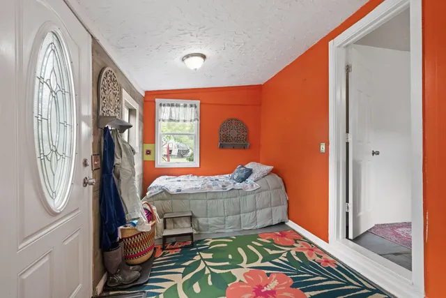 a bathroom with a sink toilet and window