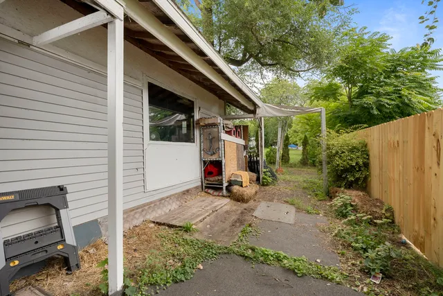 a backyard of a house with seating space