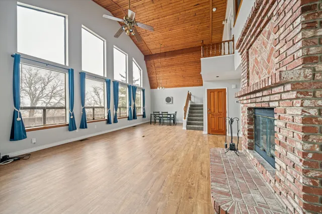 a view of an entryway with wooden floor