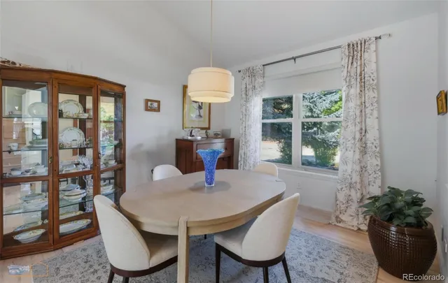 a view of a dining room with furniture window and wooden floor