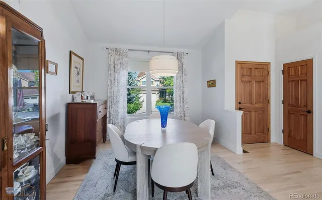 a dining room with furniture and window