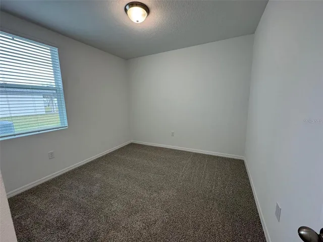 a bathroom with a sink toilet vanity and tub