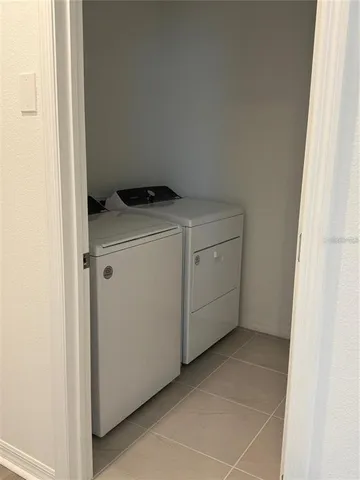 a view of park with large trees