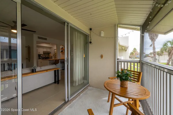 a view of a balcony dining area