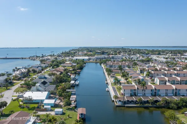 an aerial view of a house with a lake view