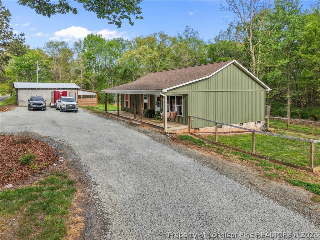 186 Lewis Brown Road Bennett, NC 27208 - Photo 33 of 48 a house view with a garden space