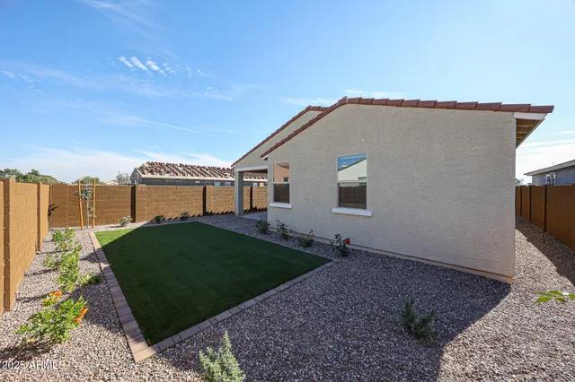a house view with a backyard space