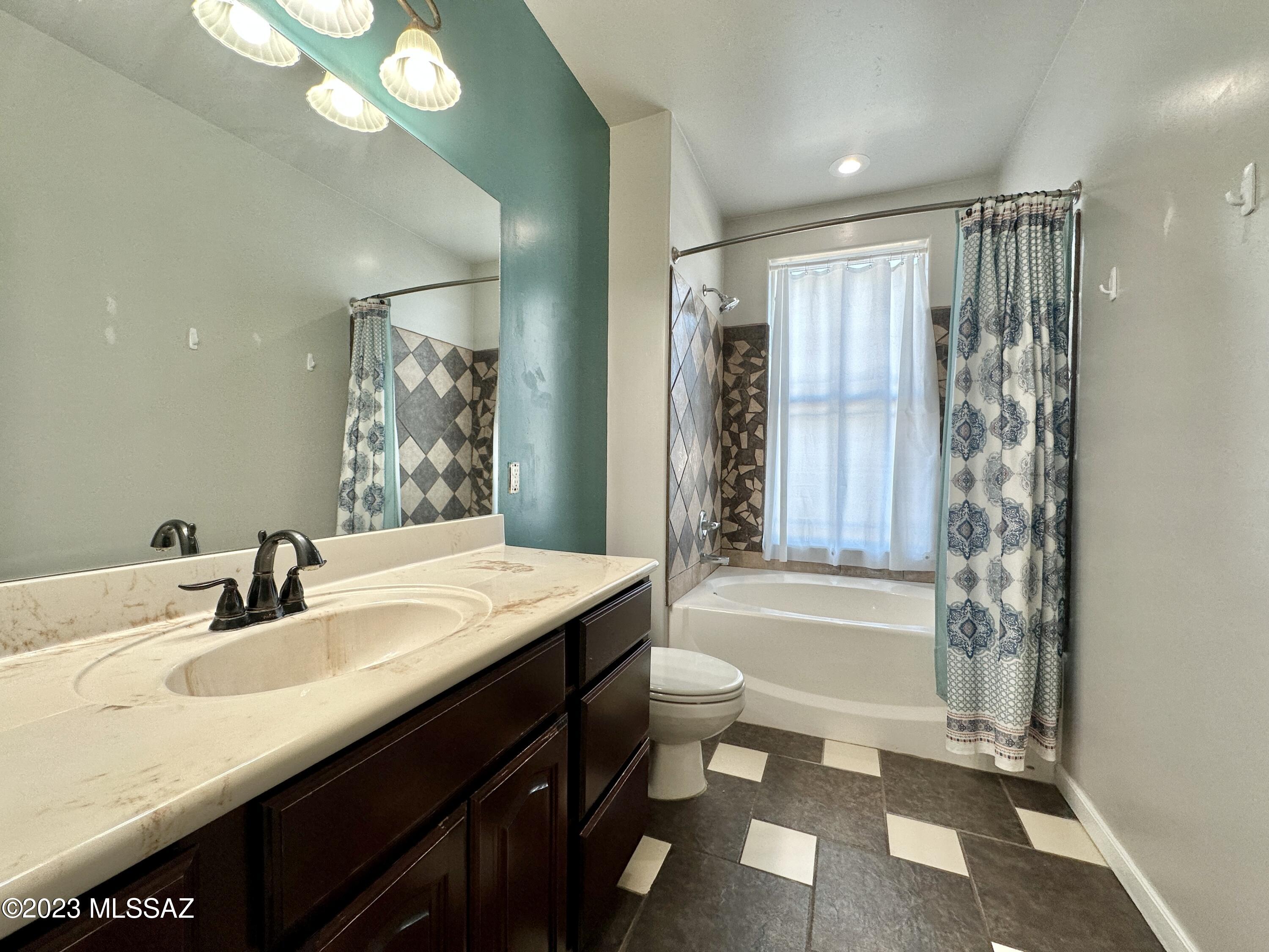 508 Eagle Meadow Loop Thatcher, AZ 85552 - Photo 21 of 32 a bathroom with a double vanity sink toilet mirror and bathtub
