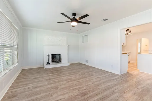 a kitchen with stainless steel appliances granite countertop a stove a microwave and a refrigerator