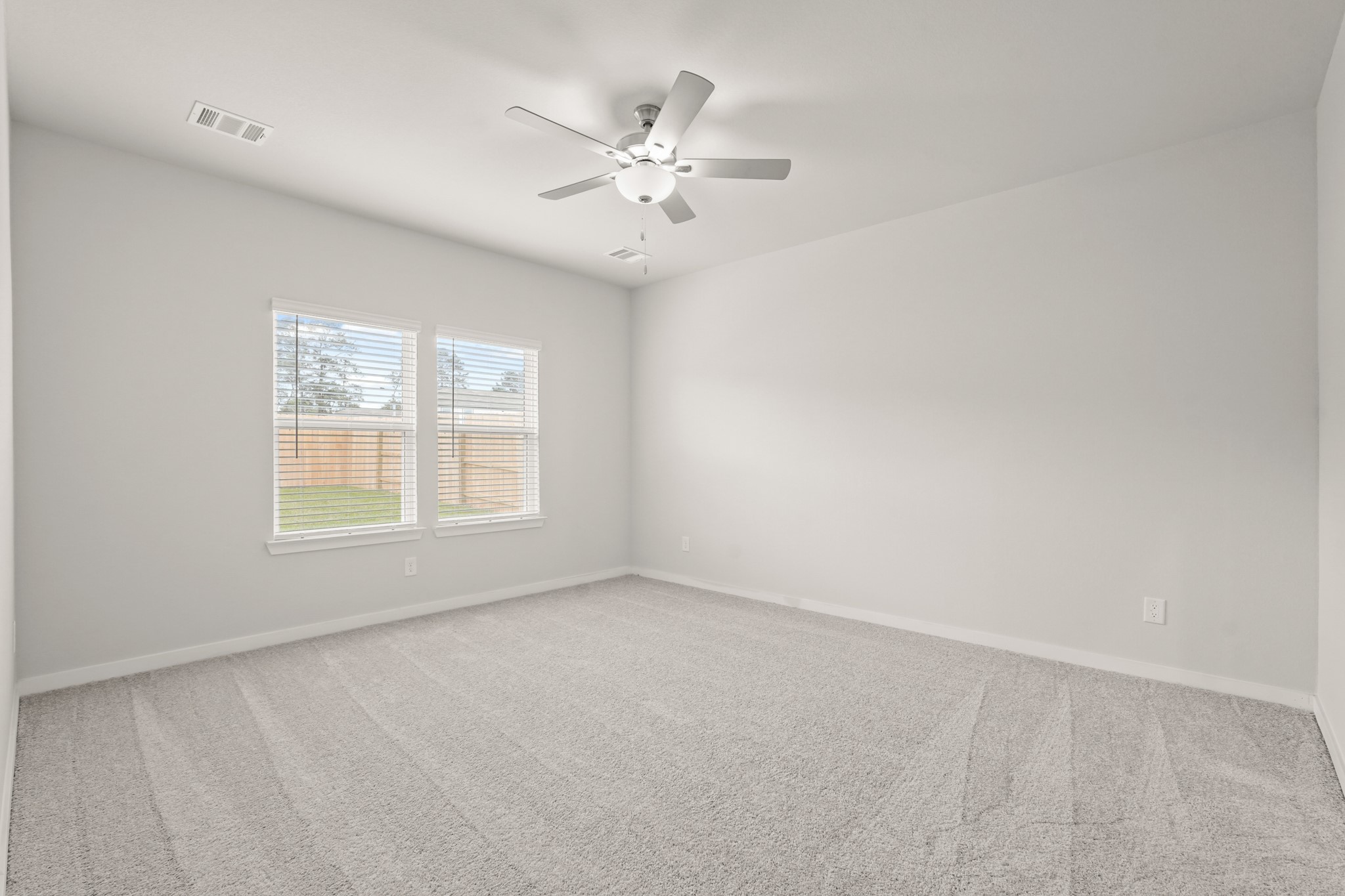 113 Rising Cedar Lane Hockley, TX 77447 - Photo 13 of 27 an empty room with a window and a ceiling fan