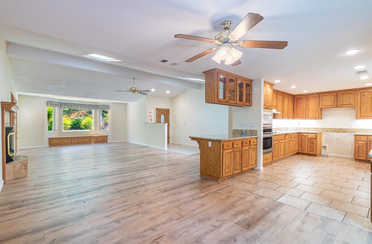 49709 Meadowview Drive Oakhurst, CA 93644 - Photo 17 of 59 a view of kitchen with cabinets and wooden floor