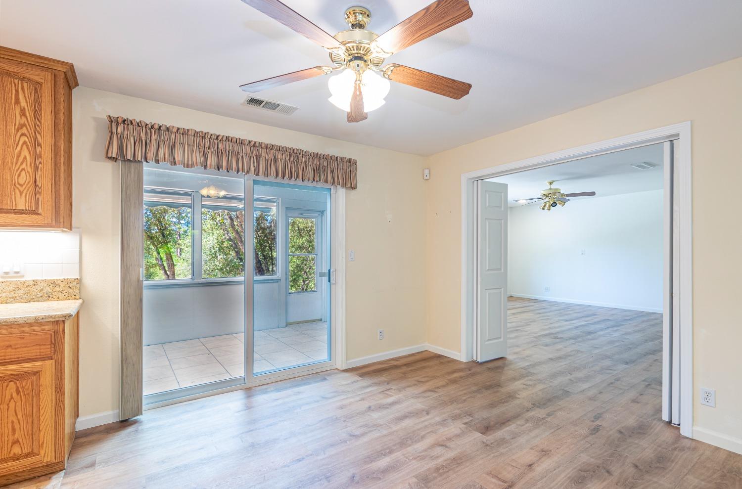 49709 Meadowview Drive Oakhurst, CA 93644 - Photo 24 of 59 wooden floor in an empty room with a window
