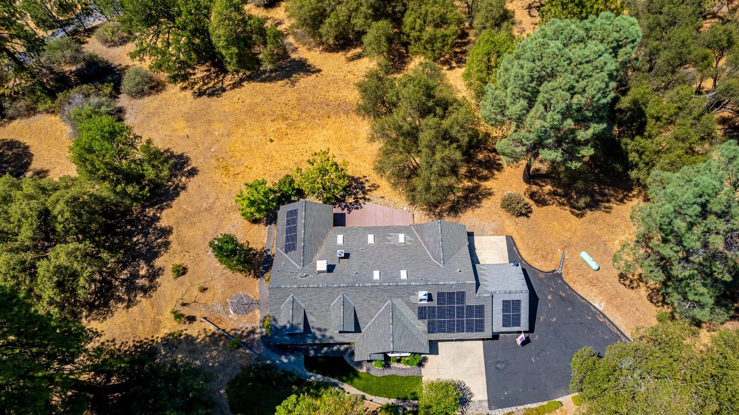 49709 Meadowview Drive Oakhurst, CA 93644 - Photo 3 of 59 an aerial view of multiple houses with yard